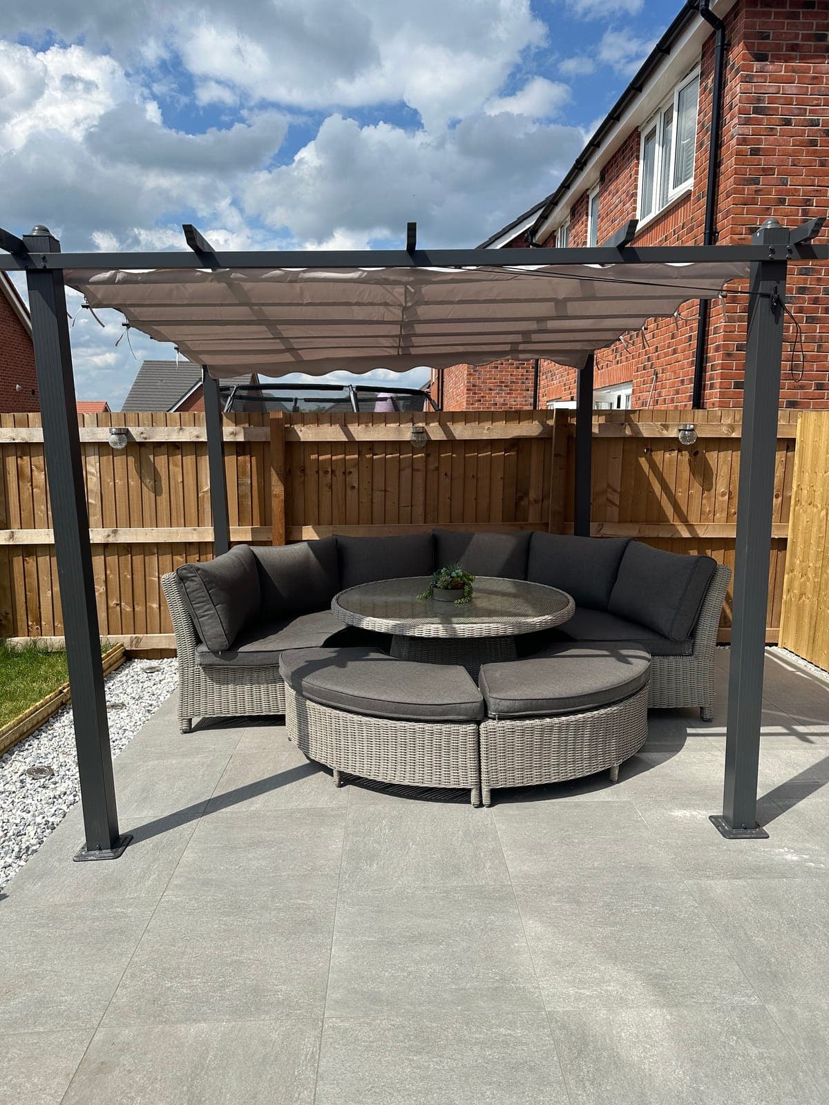 Patio & Pergola — Porcelain patio with pergola-covered seating area and bespoke timber planters.