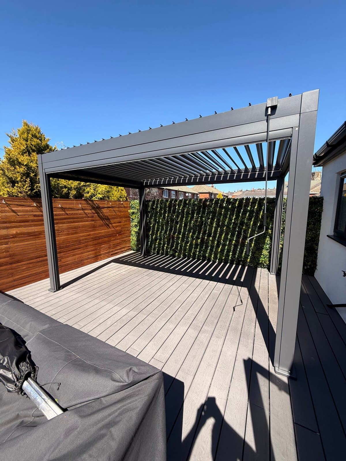 Pergola Over Decking — Louvered aluminium pergola installed over a composite deck.